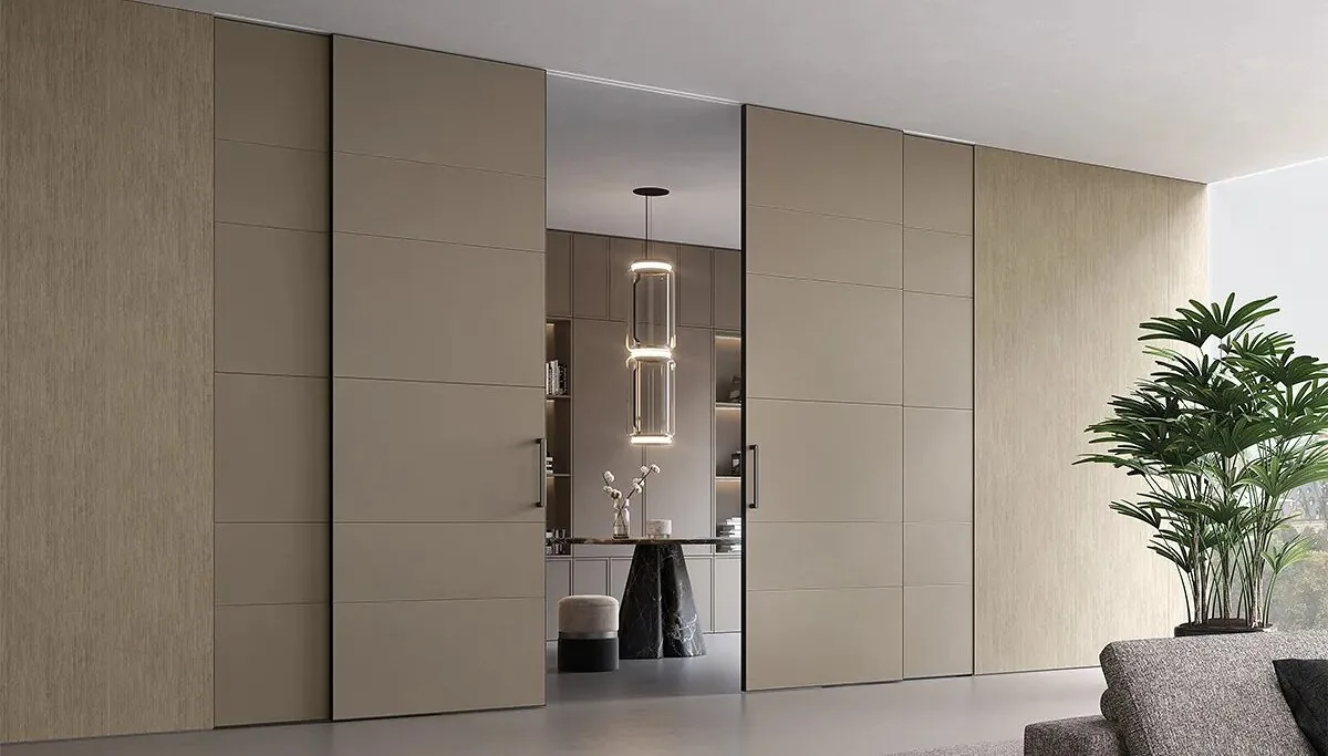 An entrance hall with a panelled wall and a concealed door