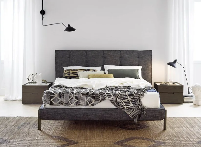 A soft headboard and matching bedsides