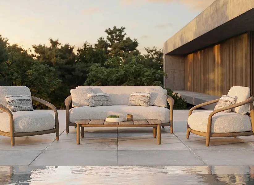 A teak lounge set by the water
