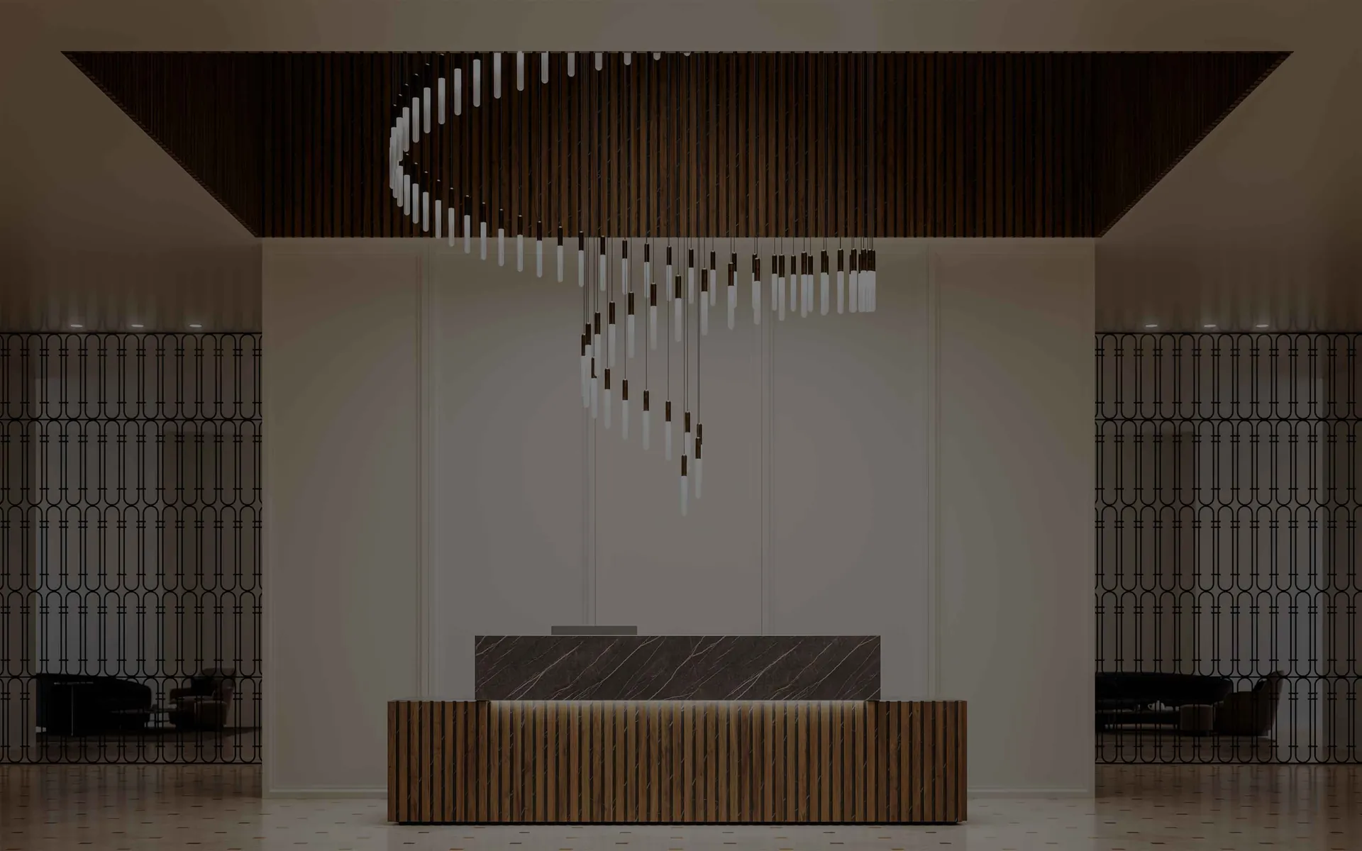 Cascade of Levante pendants in a spiral above a counter of dark wood and marble