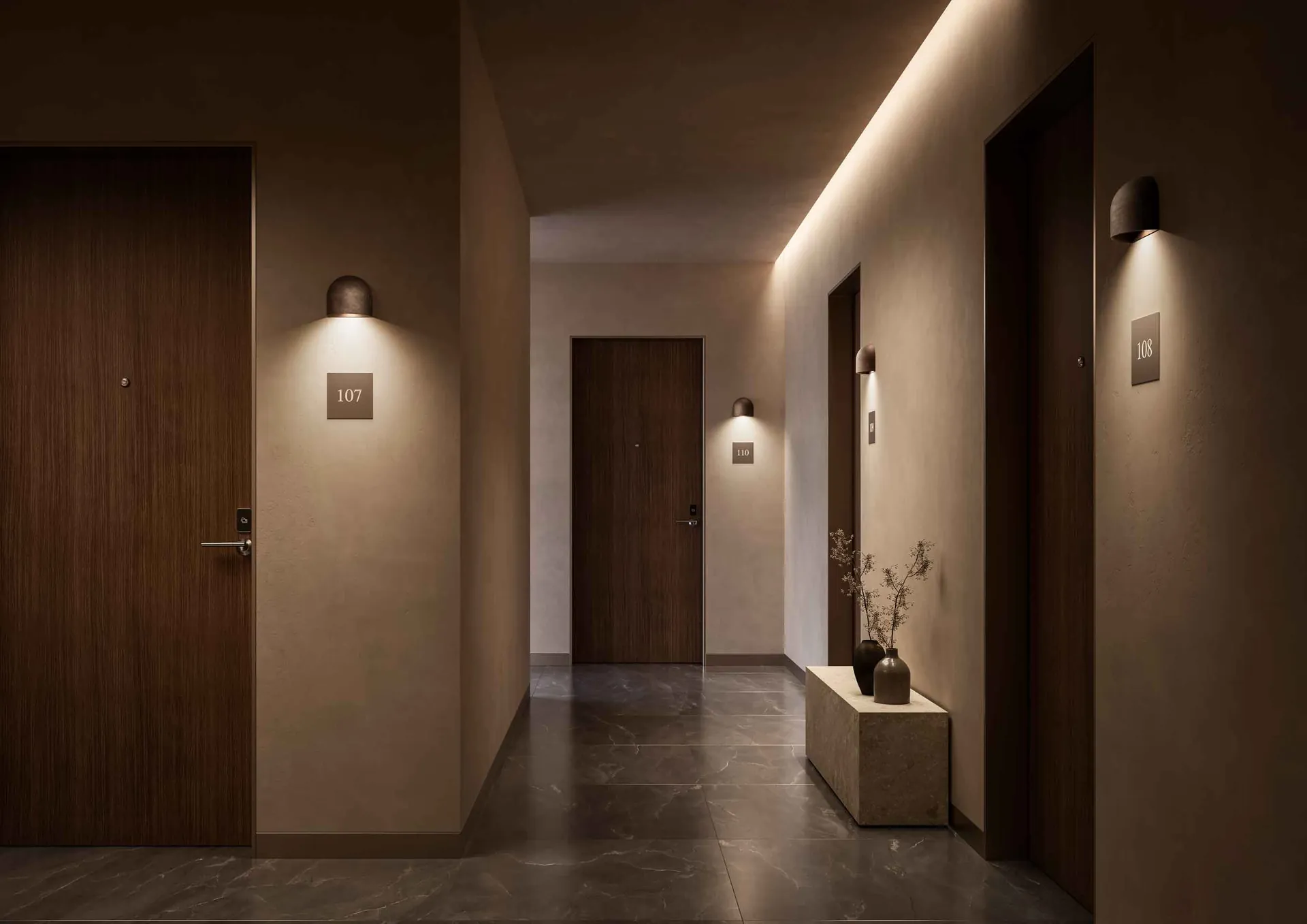Il Fanale Mask wall light by dark wood doors in a corridor with concealed ceiling lighting