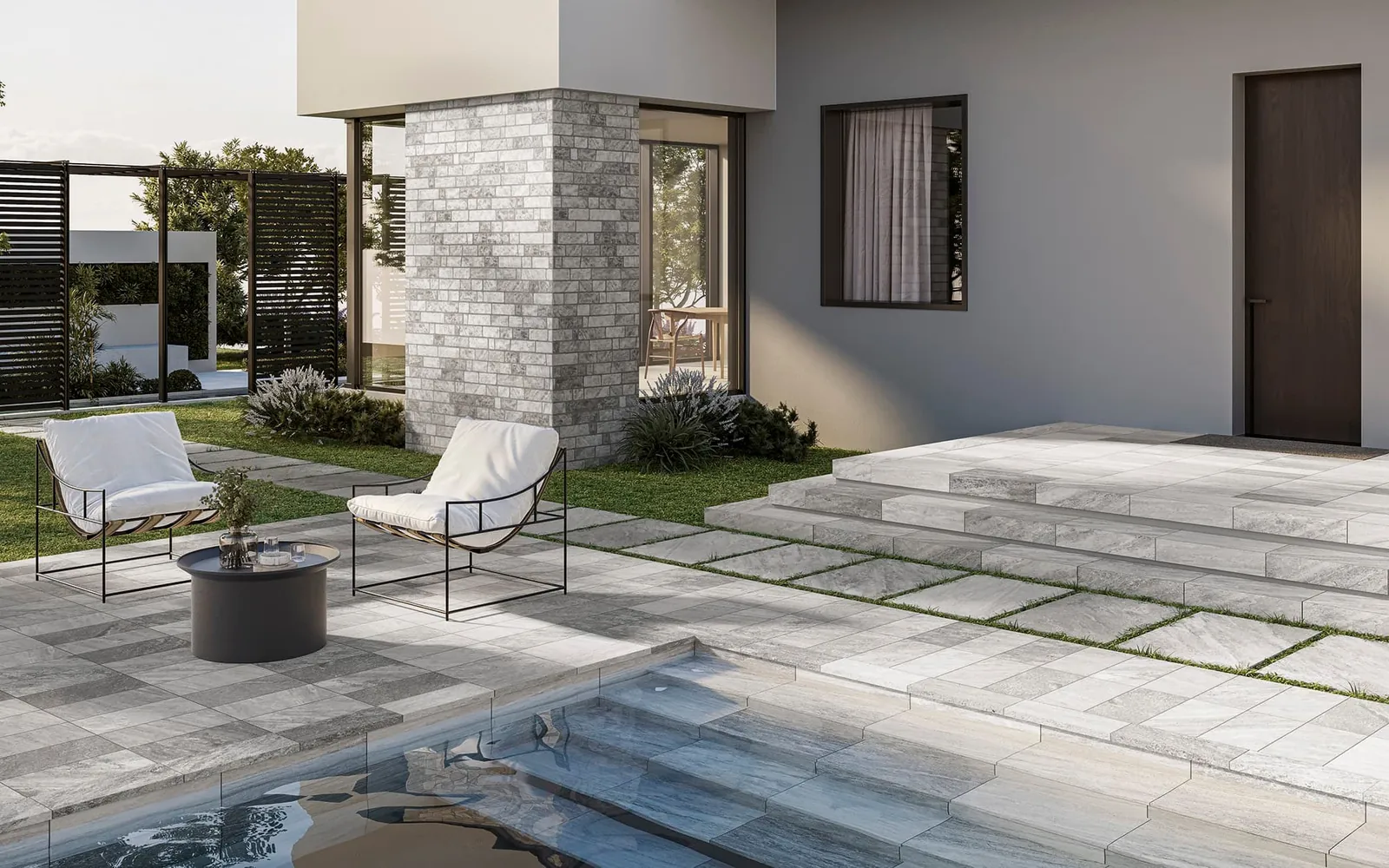 Losas de exterior y peldaños de Sichenia junto a la piscina, delante de la casa.